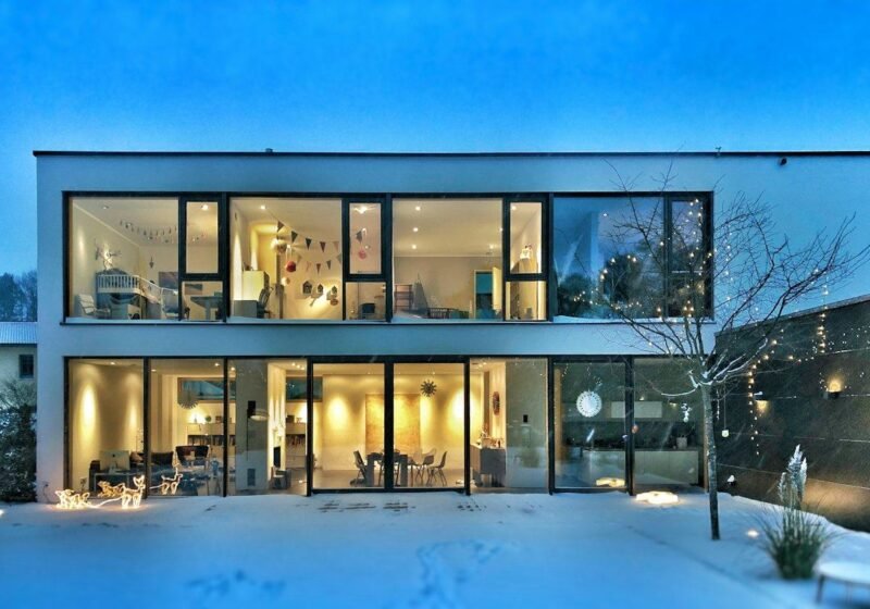 Two-storey glass-fronted villa in a residential neighbourhood