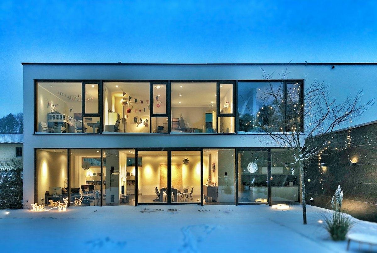 Two-storey glass-fronted villa in a residential neighbourhood
