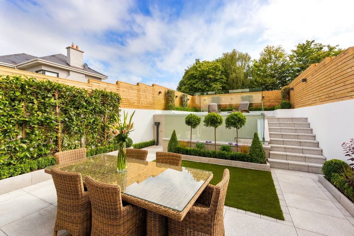 Private garden terrace with outdoor dining set
