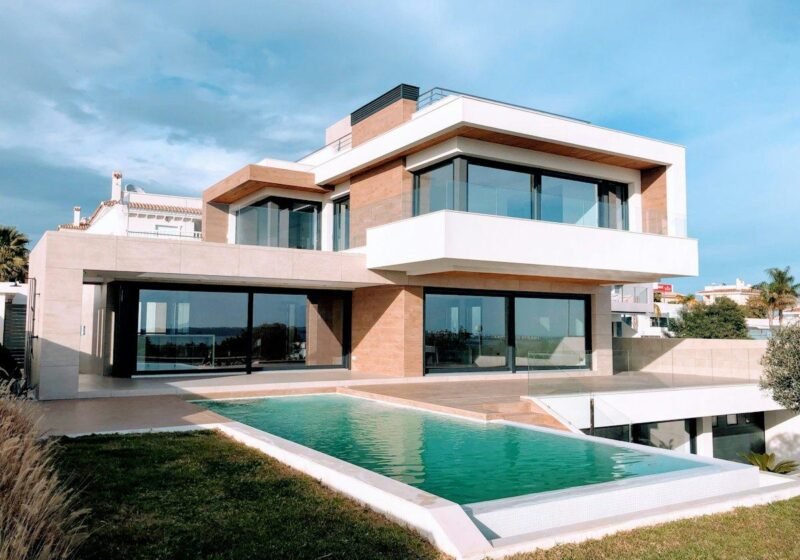 Modern two-storey villa with a private swimming pool and lawn